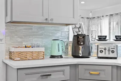a kitchen with a counter with a coffee maker on it at Steps to Sand! - Wellness Escape - Coastal Retreat in Fort Lauderdale