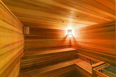 a wooden sauna with a light in it at Modern Studio in Downtown Doral in Miami