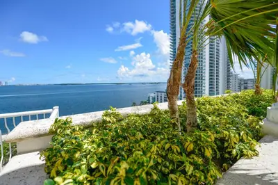 a view of the ocean from the balcony of a resort at Luxury 2BD Condo | Sauna, Pool & Resort Access in Miami