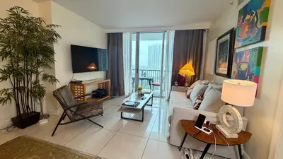 a living room with a couch and a table at Urban Warmth Retreat in Miami
