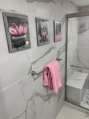 a bathroom with a shower with a pink towel at Peace and Tranquility awaits in Miami Gardens