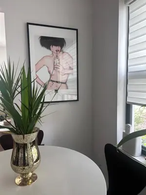 a vase sitting on a table with a plant at Cozy Home away from home! in Miami
