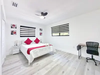 a white bedroom with a bed and a desk at Lux Miami Escape - Near Brickell- Free Parking in Miami