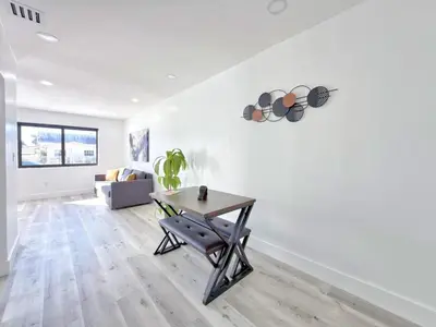 a living room with a table and a couch at Miami Lux Retreat - Free Parking - Near Brickell in Miami