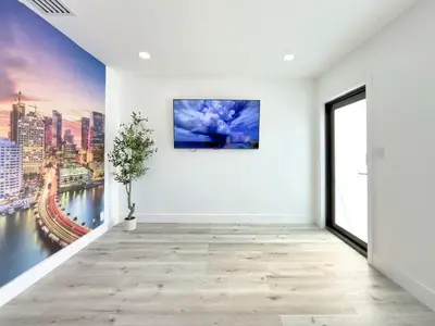 a room with a large painting on the wall at Miami Lux Retreat - Free Parking - Near Brickell in Miami