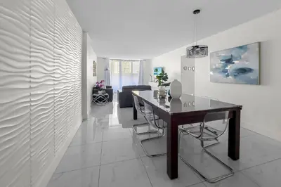 a dining room with a table and chairs at Hollywood 1 BR Apt w Gym and Pool near the Beach in Hollywood