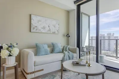 a living room with a couch and a table at 72 Park Ocean view 1BR Apartment with Pool and Gym in Miami Beach