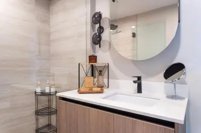 a bathroom with a sink and a mirror at 72 Park Ocean view 1BR Apartment with Pool and Gym in Miami Beach
