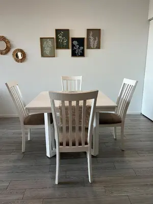 a white dining room table and chairs with pictures on the wall at Live Miami Vibes 2 Bedrooms Bayside Steps City Views Pool in Miami