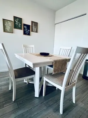 a white dining room table with chairs and a bowl on it at Live Miami Vibes 2 Bedrooms Bayside Steps City Views Pool in Miami