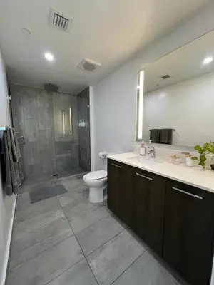 a bathroom with a sink and a toilet and a shower at Live Miami Vibes 2 Bedrooms Bayside Steps City Views Pool in Miami