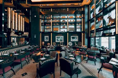 a restaurant with people sitting at tables in a room at Modern 1B at Icon Brickell 32nd fl Pool Spa Gym FREE Parking Scenic view in Miami
