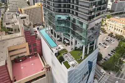 an overhead view of a building with a pool at Miami 30th floor 3BR Luxury Condo with Views in Miami