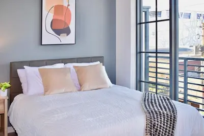 a bedroom with a bed with pillows and a window at The Juliet VIII Vibe 8706 in Miami