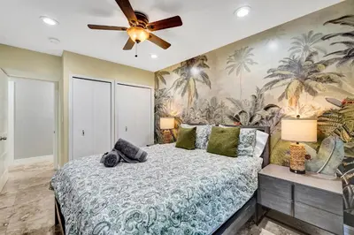 a bedroom with a bed and a ceiling fan at The Porch House - 3 Bed 2 Bath Pool Home in Hollywood