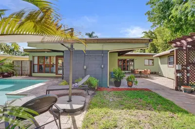 a backyard with a pool and a house at The Porch House - 3 Bed 2 Bath Pool Home in Hollywood
