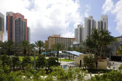 a city skyline with tall buildings and palm trees at Beautiful Sunny Isles apt 1br with PRIVATE TERRACE in Sunny Isles Beach