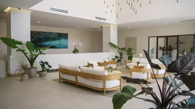 a living room with couches and chairs and plants at High Floor Property-Expansive Views- Sleep 6 Miami in North Miami