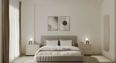 a white bedroom with a bed and two night stands at Sleep 6 in Resort Style Community- Near Stadium in North Miami