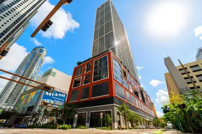 a tall building in the middle of a city at Fly Hight - Studio W Free Parking in Miami