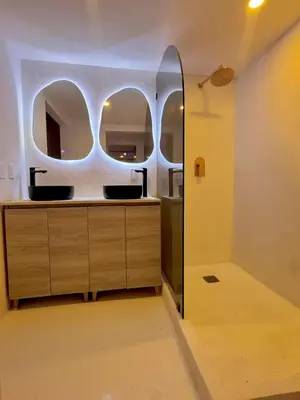 a bathroom with two sinks and a mirror at Chic & Cozy 1BR in Miami Best South Beach Location in Miami Beach