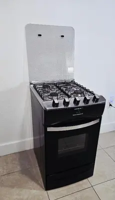 a black stove top oven sitting in a kitchen at Miami Mini Escape 5 minutes from the airport in Miami