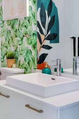a bathroom with a white sink and a mirror at Vibrant Downtown Haven with Rooftop Pool & Parking in Miami