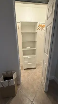 an empty closet with a white door and a box at Close to the beach, in a quiet neighborhood in Hollywood