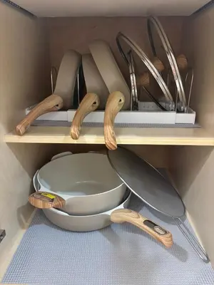 a kitchen with wooden utensils on a shelf at Close to the beach, in a quiet neighborhood in Hollywood