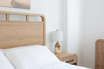 a bedroom with a bed and a lamp on a table at Modern Luxury Studio for Two in Downtown in Miami