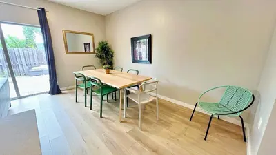 a dining room with a table and chairs at Free Parking 15 Min to Hard Rock Stadium in Miami