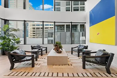 a lobby with chairs and a table in a building at Prime Downtown Location - Amazing Amenities & Top Location in Miami