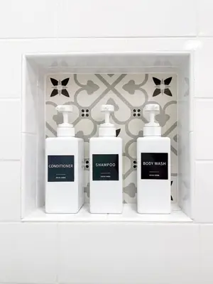 three bottles ofodorizers sit on a shelf in a bathroom at Family Pool Retreat 3 BR House for more than 8 Guests in Hollywood