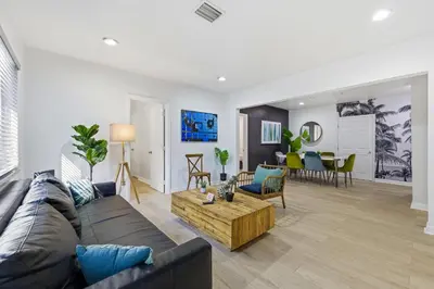 a living room with a couch and a table at Prime Location Miami House W Free Parking in Miami