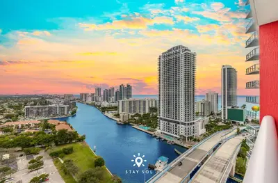 a view of a city with a river and buildings at Spacious 2BR apt - Amazing Balcony View in Hallandale Beach