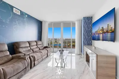 a living room with a couch and a table at One Bedroom - Amazing Balcony in Hallandale Beach