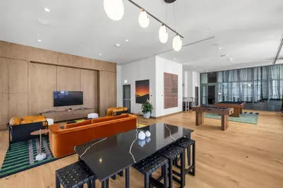 a living room with a couch and a table at Skyline Views - Steps from Bayfront Park in Miami