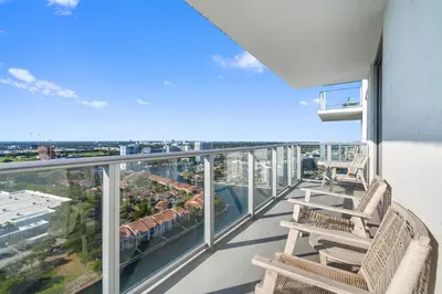 a balcony with chairs and a view of the city at Spectacular 3br and 2ba in Hyde Beach House in Hollywood