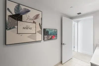 a hallway with three framed pictures on a wall at Spectacular 3br and 2ba in Hyde Beach House in Hollywood
