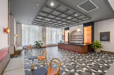 a lobby with chairs and a table in a building at Modern Studio w Skyline Views by Bayfront Park in Miami