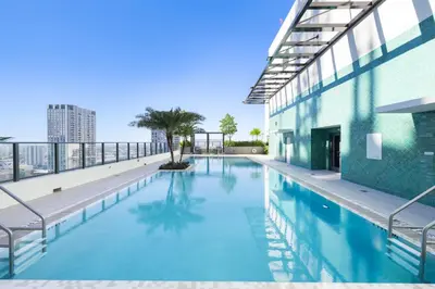 a swimming pool on the roof of a building at Downtown lifestyle - Luxury condo & Rooftop Pool in Miami