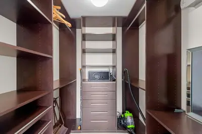 a closet with a staircase and a radio in it at Luxury Waterfront W Hotel Condo Brickell Skyline Views in Miami