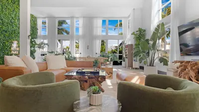 a living room with a couch and chairs and a table at Jungle Penthouse Private Pool in South Beach in Miami Beach