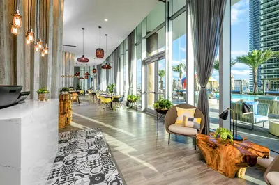 a lobby of a building with a pool at Luxury Condo with Beach Access in Hollywood