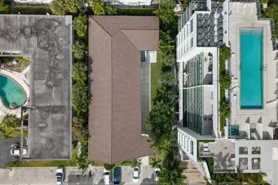 an overhead view of a building with a swimming pool at 2BR near Bal Harbour beautiful in Miami Beach