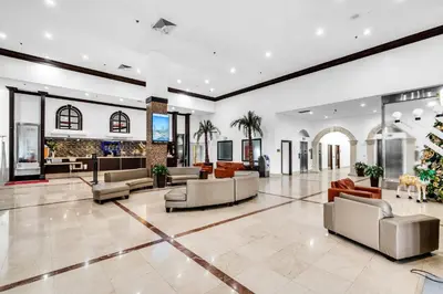 an office lobby with couches and a christmas tree at Beachfront Resort Studio with 2 Queen beds, Balcony & Pool in Sunny Isles Beach