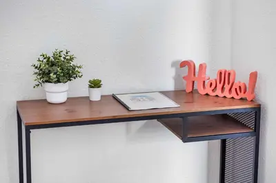 a wooden shelf with two potted plants and a book at Art Deco Gem by the Beach King Bed & Parking in Miami Beach