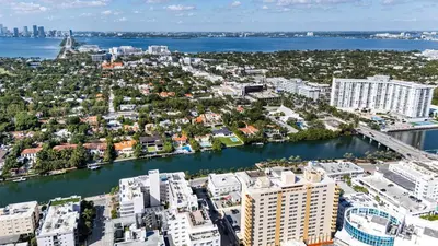 an aerial view of a city with a river and buildings at Art Deco Gem Steps to Beach in Miami Beach