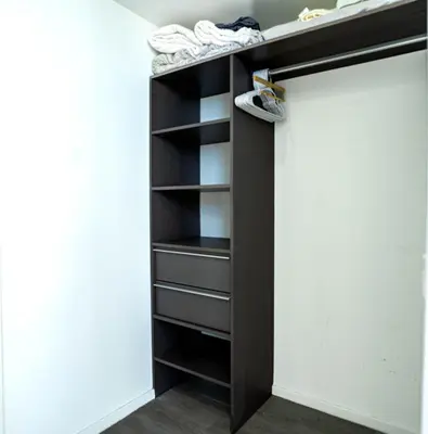 a closet with a black door and some shoes at Downtown Miami 2BR Retreat - Walk to Bayside & Port - Sleeps 6 in Miami