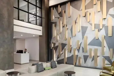 a lobby with a large wall with arrows on it at Blueground Coral Gables pool wd nr Vizcaya MIA-125 in Miami